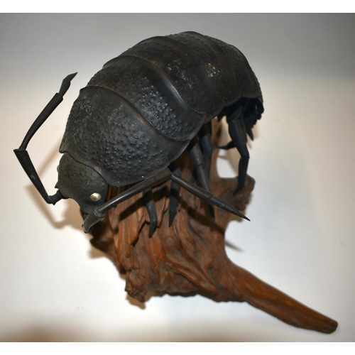 883 - AN EARLY 20TH CENTURY JAPANESE MEIJI PERIOD BRONZE OKIMONO modelled as a beetle roaming on a wooden ... 