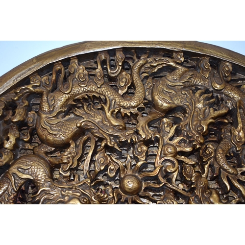 891 - A 19TH CENTURY CHINESE CARVED GILTWOOD DRAGON PANEL Qing. 38 cm x 28 cm.