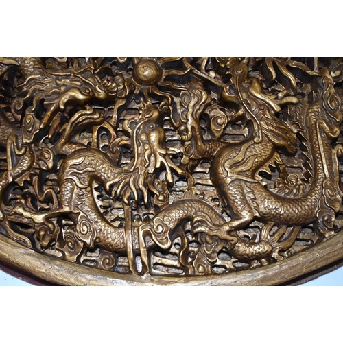 891 - A 19TH CENTURY CHINESE CARVED GILTWOOD DRAGON PANEL Qing. 38 cm x 28 cm.