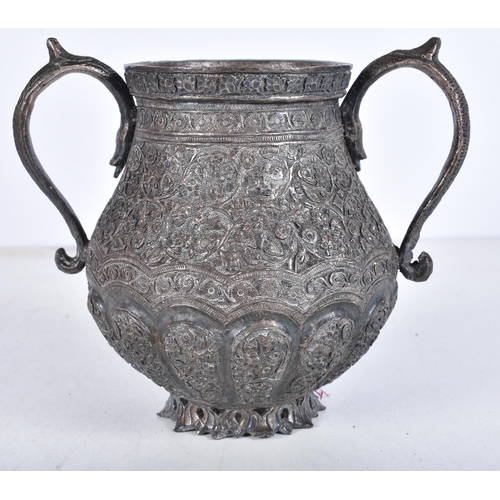 963 - Antique Islamic Heavy Metal Twin Handled Vase / Urn. 738 grams. 14.5 cm x 17 cm.