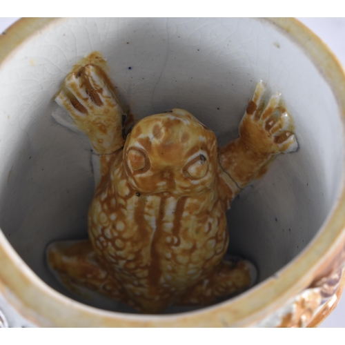 979 - AN UNUSUAL EARLY 19TH CENTURY POTTERY BACCHUS FROG JUG overlaid with vines and flowers. 13 cm high.