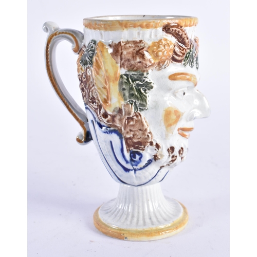 979 - AN UNUSUAL EARLY 19TH CENTURY POTTERY BACCHUS FROG JUG overlaid with vines and flowers. 13 cm high.