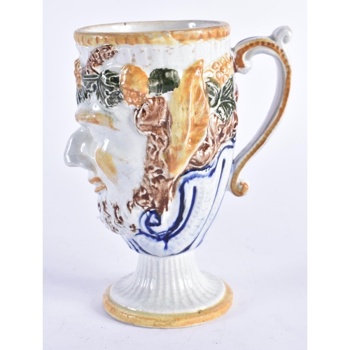 979 - AN UNUSUAL EARLY 19TH CENTURY POTTERY BACCHUS FROG JUG overlaid with vines and flowers. 13 cm high.