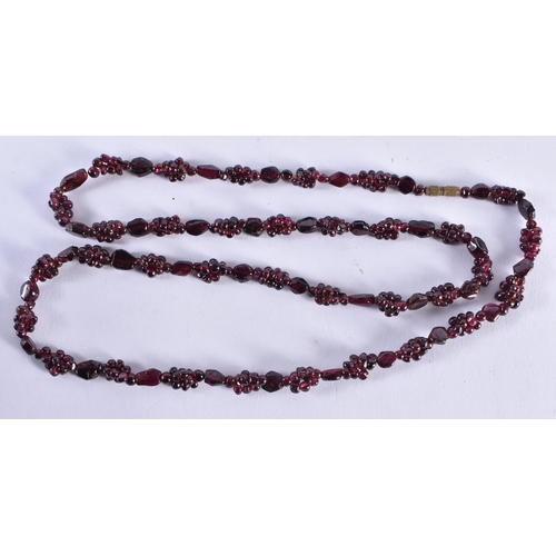 991 - AN ANTIQUE GARNET NECKLACE. 68 cm long.