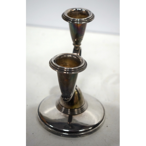 1541 - A pair of English silver candlesticks. 185 grams overall. 13 cm x 11 cm.