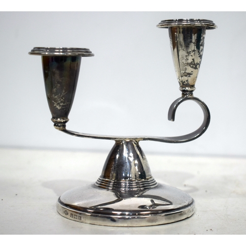 1541 - A pair of English silver candlesticks. 185 grams overall. 13 cm x 11 cm.