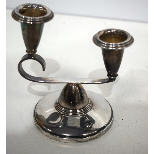 1541 - A pair of English silver candlesticks. 185 grams overall. 13 cm x 11 cm.