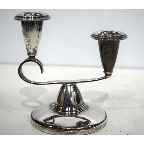 1541 - A pair of English silver candlesticks. 185 grams overall. 13 cm x 11 cm.