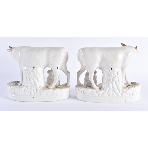 10 - A PAIR OF 19TH CENTURY STAFFORDSHIRE MILKING COW FIGURAL GROUPS. 18 cm x 18 cm.