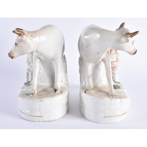 10 - A PAIR OF 19TH CENTURY STAFFORDSHIRE MILKING COW FIGURAL GROUPS. 18 cm x 18 cm.