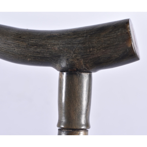 101 - A 19TH CENTURY ANGLO INDIAN CARVED HORN WALKING CANE possibly black rhinoceros. 90 cm long.