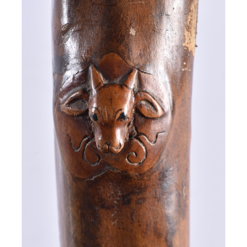 104 - AN 18TH/19TH CENTURY CONTINENTAL CARVED FOLK ART WOOD WALKING CANE formed with grotesque beasts and ... 