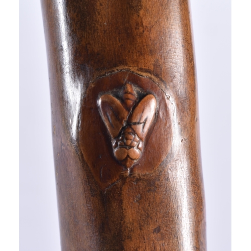 104 - AN 18TH/19TH CENTURY CONTINENTAL CARVED FOLK ART WOOD WALKING CANE formed with grotesque beasts and ... 