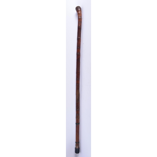 105 - A 19TH CENTURY JAPANESE MEIJI PERIOD CARVED BAMBOO GEISHA WALKING CANE. 86 cm long.