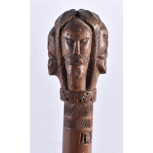 108 - AN 18TH/19TH CENTURY GREEK CARVED WOOD WALKING CANE formed with mask heads. 80 cm long.