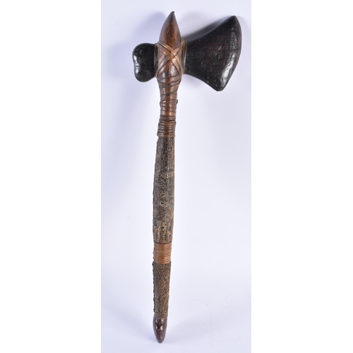 109 - AN EARLY 20TH CENTURY CONTINENTAL TRIBAL CARVED WOOD AND SNAKE SKIN AXE. 54 cm long.