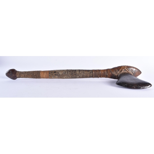 109 - AN EARLY 20TH CENTURY CONTINENTAL TRIBAL CARVED WOOD AND SNAKE SKIN AXE. 54 cm long.