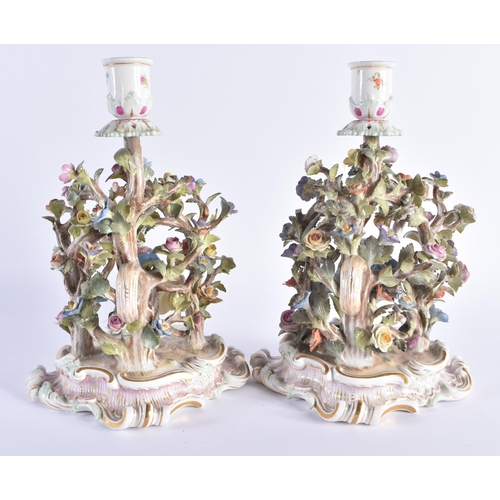 11 - A PAIR OF 19TH CENTURY MEISSEN PORCELAIN FIGURAL CANDLESTICKS modelled with figures dancing under fo... 