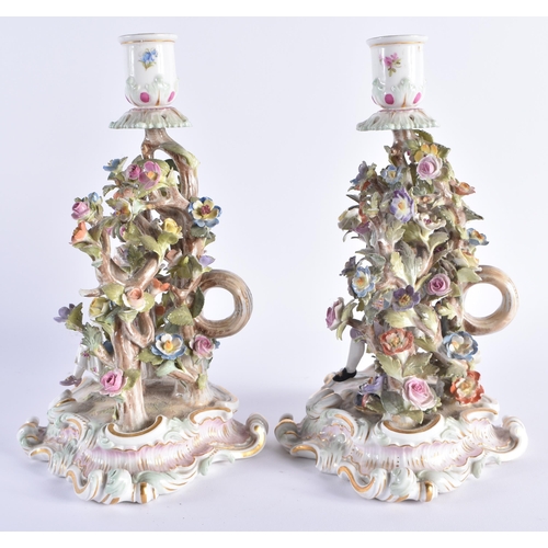 11 - A PAIR OF 19TH CENTURY MEISSEN PORCELAIN FIGURAL CANDLESTICKS modelled with figures dancing under fo... 