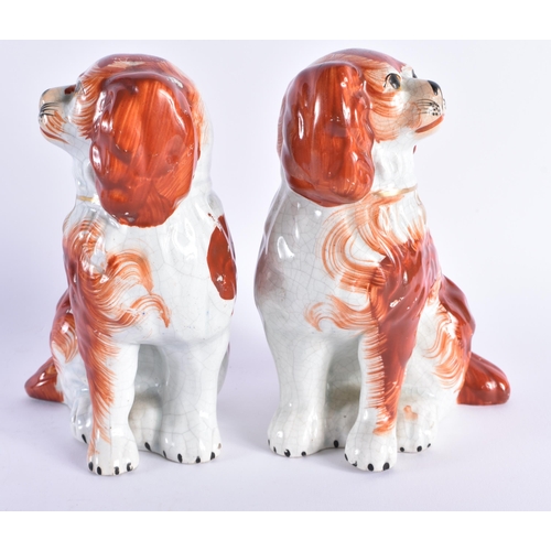 115 - A PAIR OF 19TH CENTURY STAFFORDSHIRE RED SPANIELS. 17 cm high.