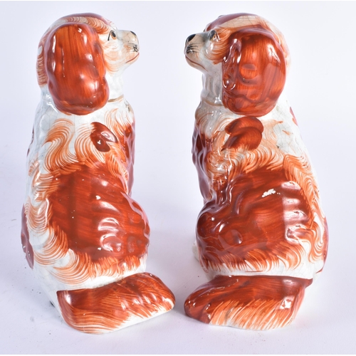 115 - A PAIR OF 19TH CENTURY STAFFORDSHIRE RED SPANIELS. 17 cm high.