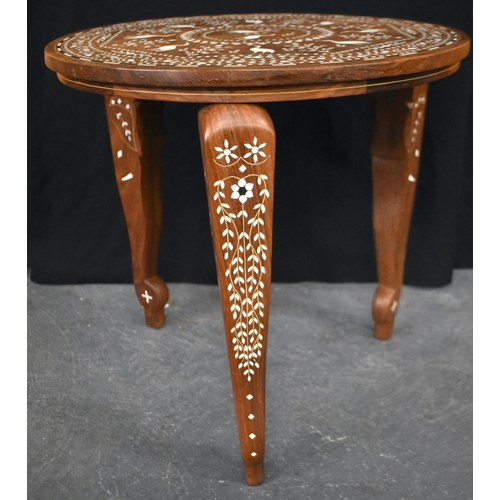 120 - AN EARLY 20TH CENTURY ANGLO INDIAN CARVED WOOD TABLE decorated with birds within landscapes. 45 cm x... 