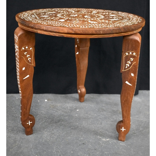 120 - AN EARLY 20TH CENTURY ANGLO INDIAN CARVED WOOD TABLE decorated with birds within landscapes. 45 cm x... 