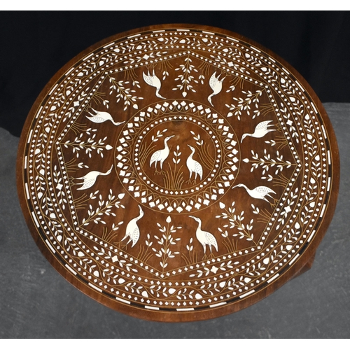 120 - AN EARLY 20TH CENTURY ANGLO INDIAN CARVED WOOD TABLE decorated with birds within landscapes. 45 cm x... 