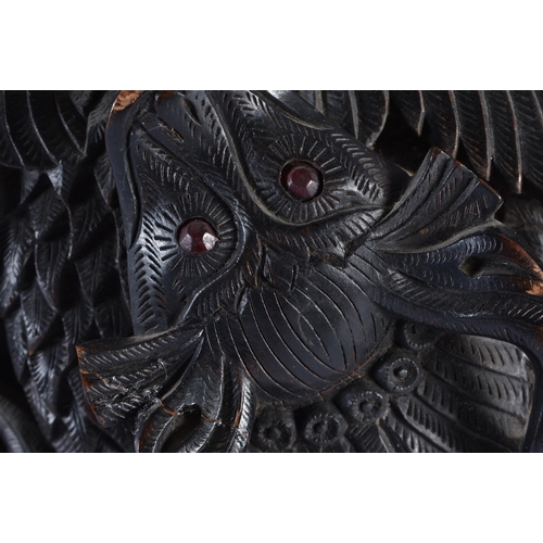 125 - A LARGE 19TH CENTURY BURMESE CARVED WOOD DRAGON AND BIRD PANEL inset with ruby coloured gems. 50 cm ... 