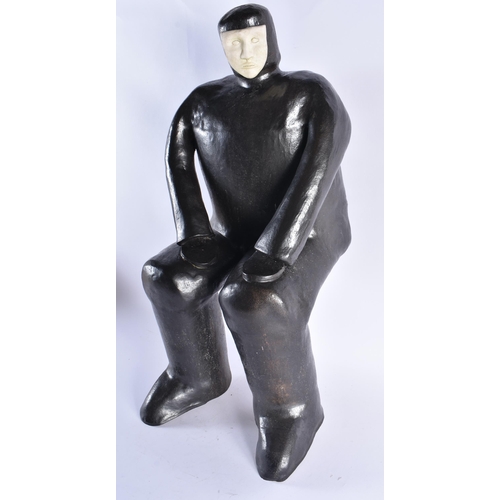 126 - A CHARMING STUDIO POTTERY CERAMIC FIGURE OF A MALE by Michel Ducos, Alford Pottery, modelled seated ... 