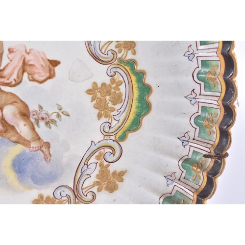 128 - A PAIR OF 18TH CENTURY CONTINENTAL FLUTED POTTERY DISHES painted with putti. 25 cm wide.