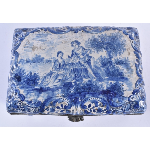 129 - A 19TH CENTURY DUTCH DELFT TIN GLAZED POTTERY CASKET painted with figures within a landscape. 20 cm ... 