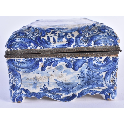 129 - A 19TH CENTURY DUTCH DELFT TIN GLAZED POTTERY CASKET painted with figures within a landscape. 20 cm ... 