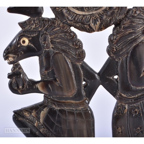 130A - AN UNUSUAL 19TH CENTURY BALINESE CARVED HORN DANCING BEAST SCULPTURE. 21 cm x 9 cm