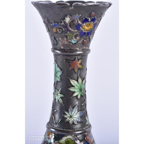 130C - A FINE PAIR OF 19TH CENTURY JAPANESE MEIJI PERIOD SILVER AND ENAMEL VASES decorated with birds and f... 