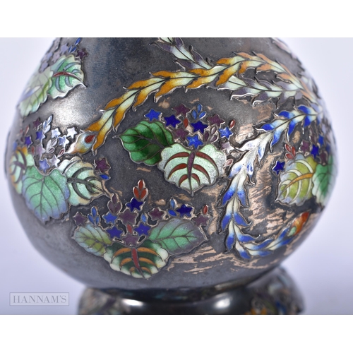 130C - A FINE PAIR OF 19TH CENTURY JAPANESE MEIJI PERIOD SILVER AND ENAMEL VASES decorated with birds and f... 