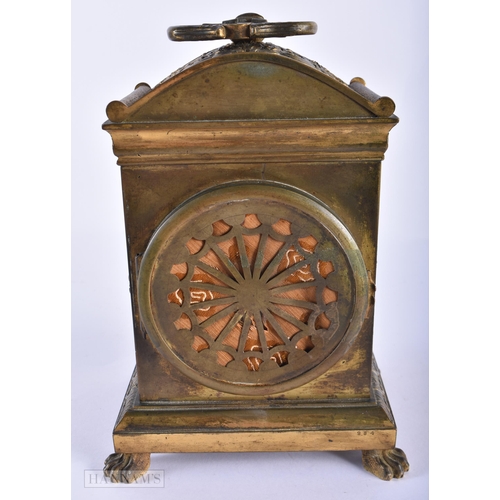 130D - AN EARLY 19TH CENTURY FRENCH ORMOLU CLOCK Courvoisier Et Comp, decorated with repousse foliage, upon... 