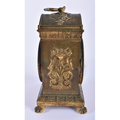 130D - AN EARLY 19TH CENTURY FRENCH ORMOLU CLOCK Courvoisier Et Comp, decorated with repousse foliage, upon... 