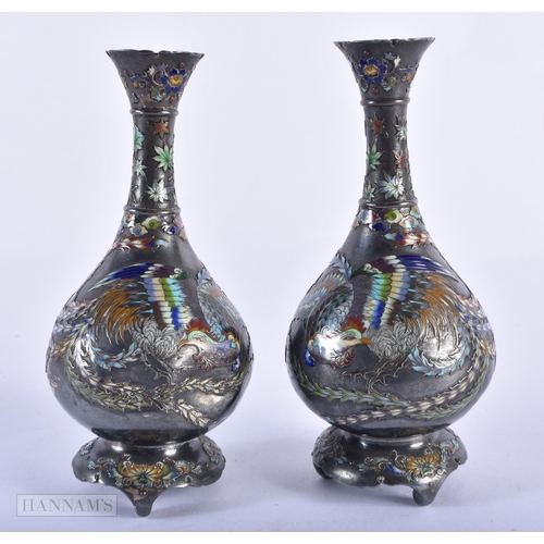 130C - A FINE PAIR OF 19TH CENTURY JAPANESE MEIJI PERIOD SILVER AND ENAMEL VASES decorated with birds and f... 