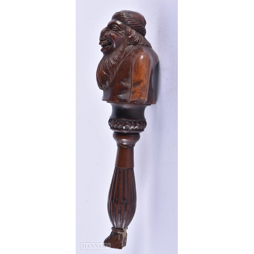 135A - AN EARLY 19TH CENTURY CARVED FRUITWOOD TREEN NUT CRACKER formed as a half torso. 19 cm x 7 cm