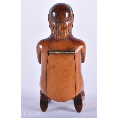 135C - A LOVELY EARLY 19TH CENTURY CARVED FRUITWOOD TREEN SNUFF BOX formed as a male with hands clasped upo... 