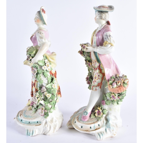 135 - A LARGE PAIR OF 18TH CENTURY ENGLISH PORCELAIN FIGURES modelled as a male and female encrusted with ... 