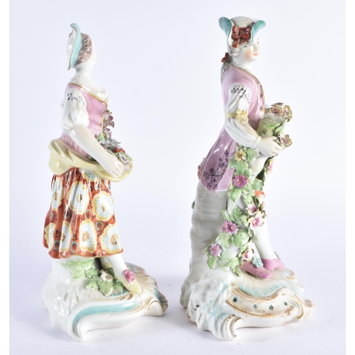 135 - A LARGE PAIR OF 18TH CENTURY ENGLISH PORCELAIN FIGURES modelled as a male and female encrusted with ... 