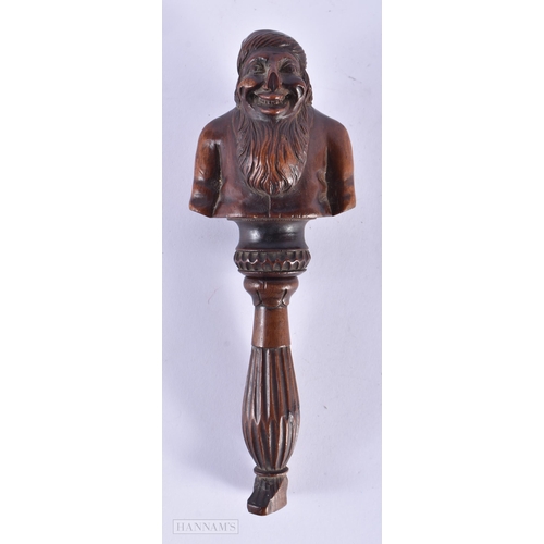 135A - AN EARLY 19TH CENTURY CARVED FRUITWOOD TREEN NUT CRACKER formed as a half torso. 19 cm x 7 cm