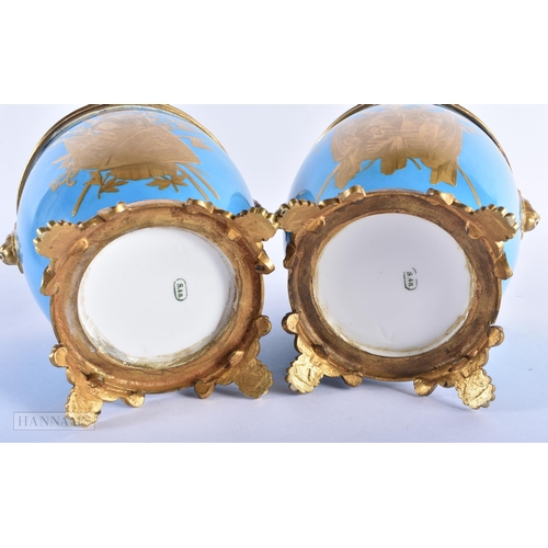 140B - A PAIR OF 19TH CENTURY FRENCH SEVRES PORCELAIN POT POURRI AND COVERS painted with gilt flowers. 27 c... 