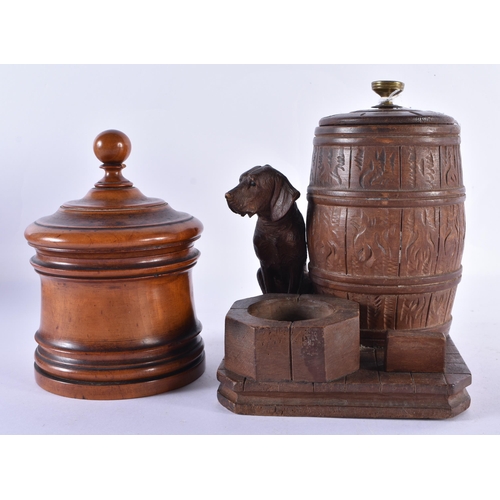 141 - AN ANTIQUE BLACK FOREST BAVRIAN DOG DESK STAND together with a treen jar and cover. Largest 16 cm x ... 