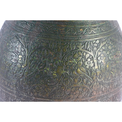 142 - A LARGE 18TH/19TH CENTURY PERSIAN ISLAMIC BRONZE ALLOY JUG decorated all over with birds, foliage an... 