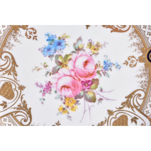 150 - A PAIR OF ROYAL CROWN DERBY FLORAL CABINET PLATES. 22.5 cm wide.