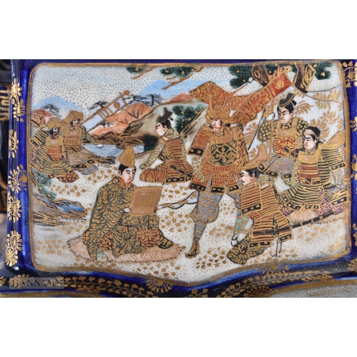 150D - A 19TH CENTURY JAPANESE MEIJI PERIOD TWIN HANDLED SATSUMA KORO AND COVER painted with figures within... 