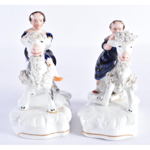 154 - A PAIR OF 19TH CENTURY STAFFORDSHIRE PORCELAIN FIGURES modelled as the Queens children riding goats.... 